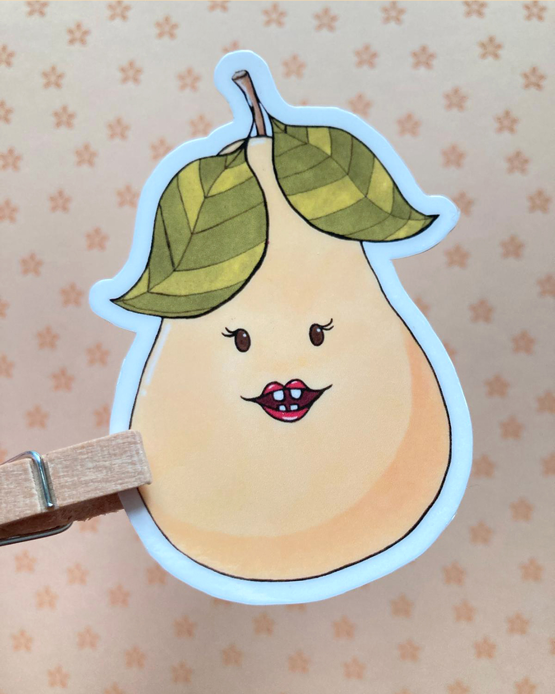 sticker d'une poire illustrée et un visage